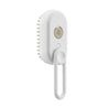 White electric steam brush with soft bristles and ergonomic handle for pet grooming
