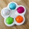 Slow-feed and stimulate dog puzzle feeder with colorful balls for mental engagement and slower eating.