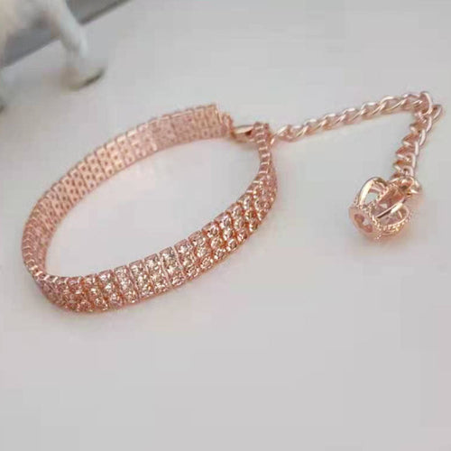 Rose gold pet collar with crown-shaped rhinestone charm and adjustable chain