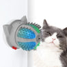 Electric Pets Cat Brush LED toy massager mounted on wall with gray and white cat next to it