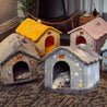 Cozy self-warming foldable dog houses in various colors and patterns, designed for pet comfort and warmth.