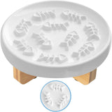 White ceramic slow feed pet feeder bowl with raised fish bone design and wooden legs